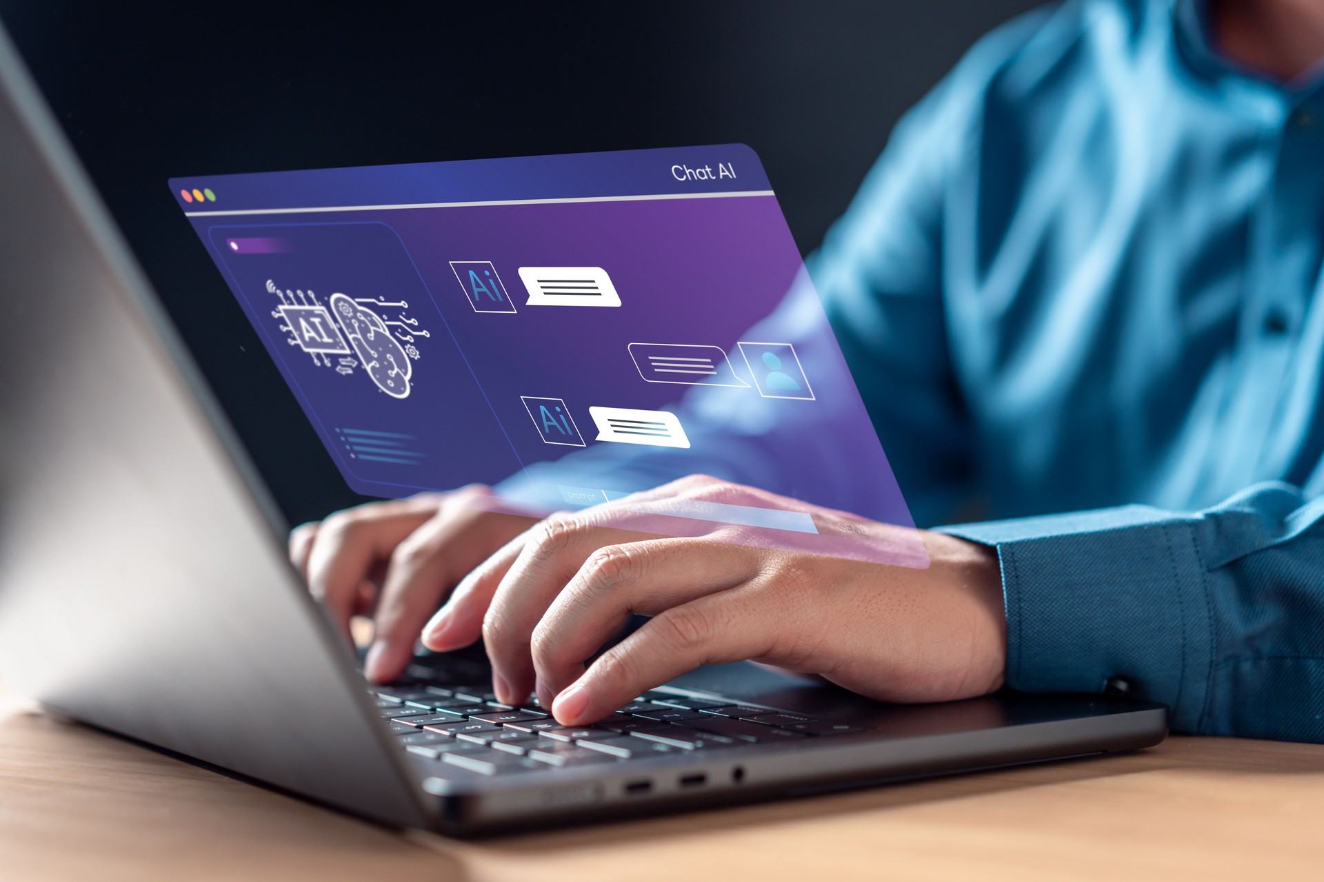 A man is typing on a laptop with a screen showing a computer program.